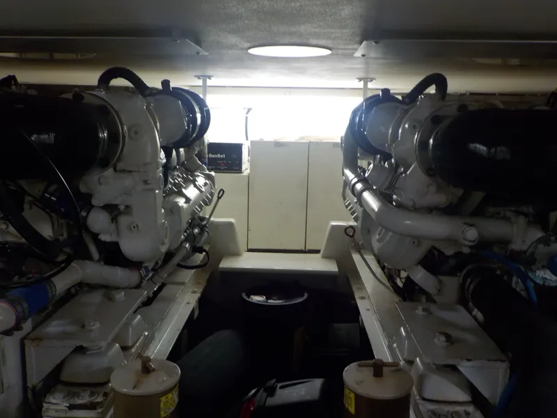 Slide: The Image of Engine room of 1996 Viking 47 Convertible yacht, showcasing dual engines. - 26