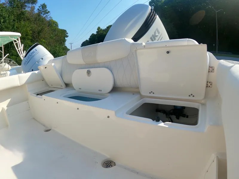 Slide: The Image of 2025 Key West 239 FS boat interior with open storage compartments. - 13