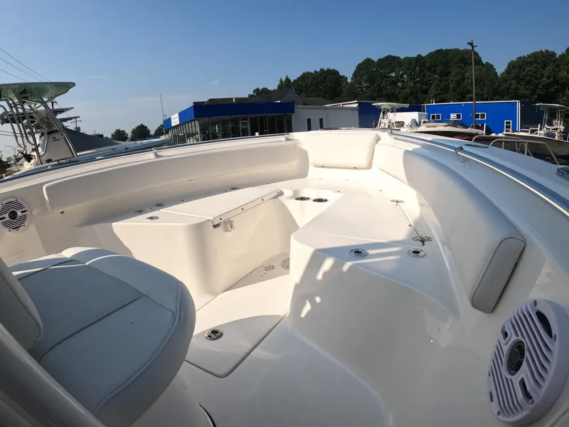 Slide: The Image of 2025 Key West 239 FS boat interior with seating and speakers. - 15