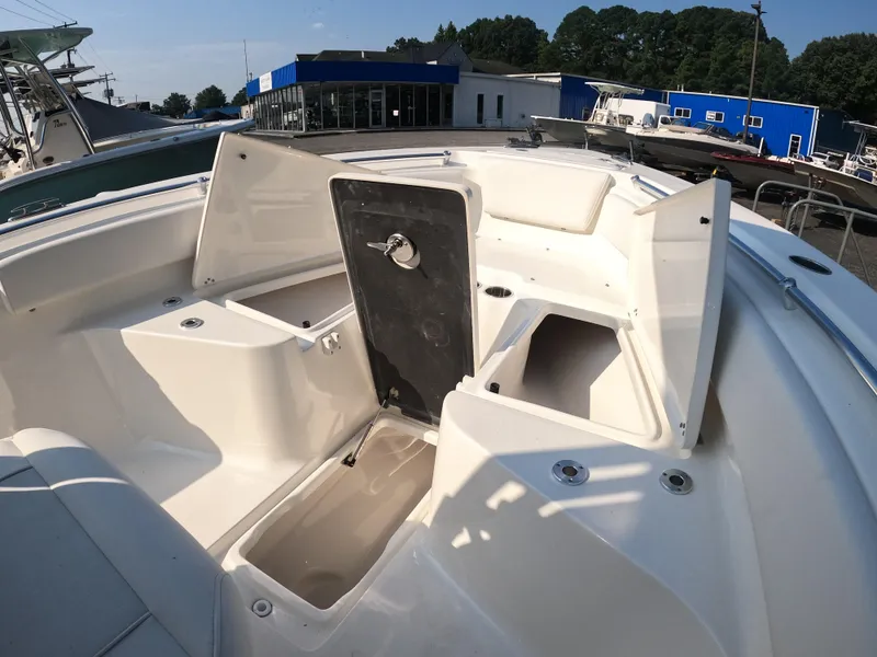 Slide: The Image of 2025 Key West 239 FS boat interior with open storage compartments. - 16