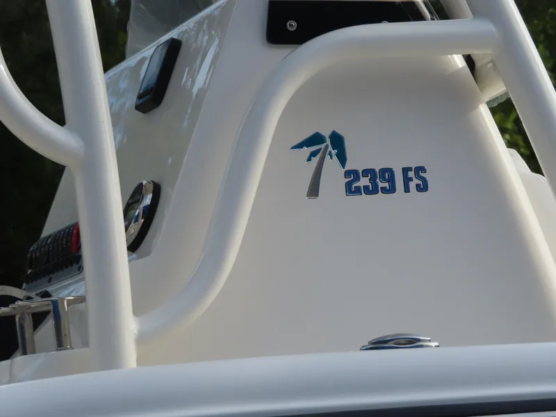 Slide: The Image of 2025 Key West 239 FS boat console with logo and controls. - 19