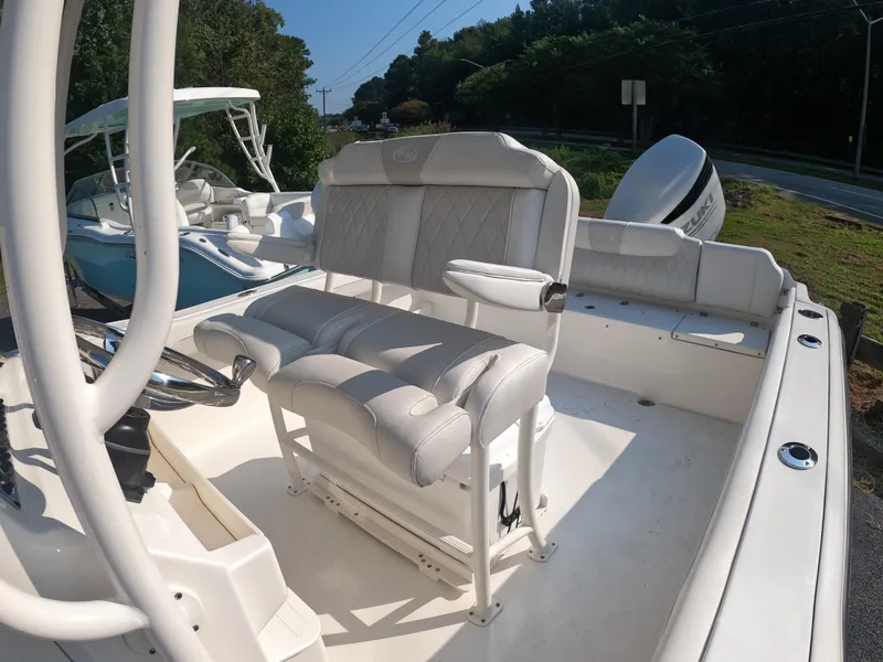 Slide: The Image of 2025 Key West 239 FS boat interior with cushioned seating and steering console. - 20