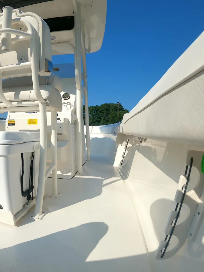 Slide: The Image of 2025 Key West 239 FS boat interior with seating and clear blue sky. - 24