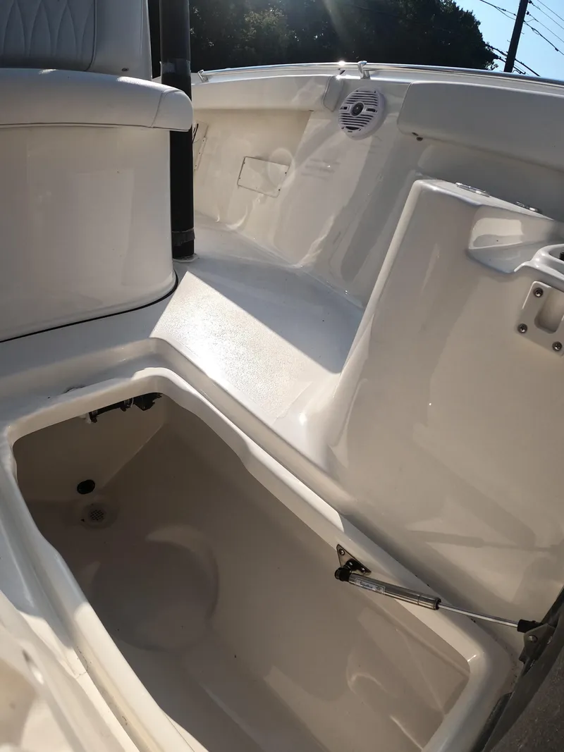 Slide: The Image of 2025 Key West 239 FS boat interior with storage compartment and seating. - 25