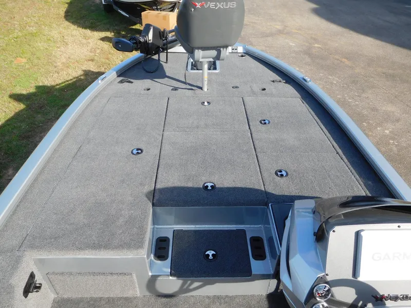 Slide: The Image of 2025 Vexus AVX 1980C boat deck with storage compartments and Garmin equipment. - 4