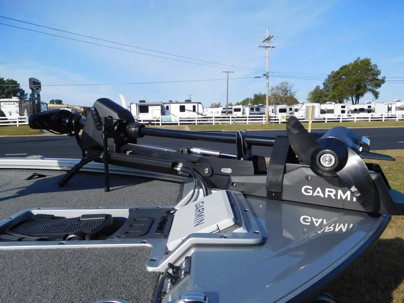 Slide: The Image of 2025 Vexus AVX 1980C boat with Garmin trolling motor, parked near RVs. - 8