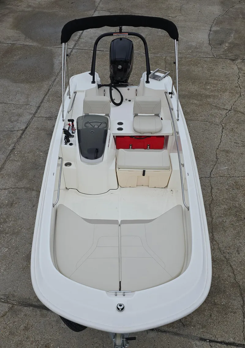 Slide: The Image of 2022 Boston Whaler 160 Super Sport boat with seating and storage, viewed from above. - 11