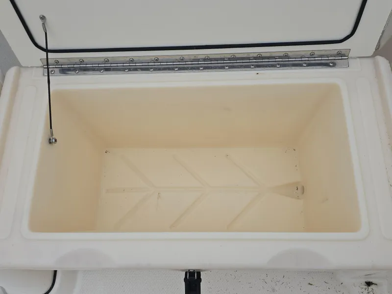 Slide: The Image of Open storage compartment on 2022 Boston Whaler 160 Super Sport boat. - 13