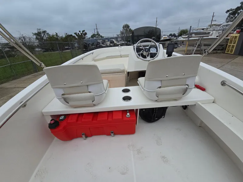 Slide: The Image of 2022 Boston Whaler 160 Super Sport interior with dual seats and steering wheel. - 18