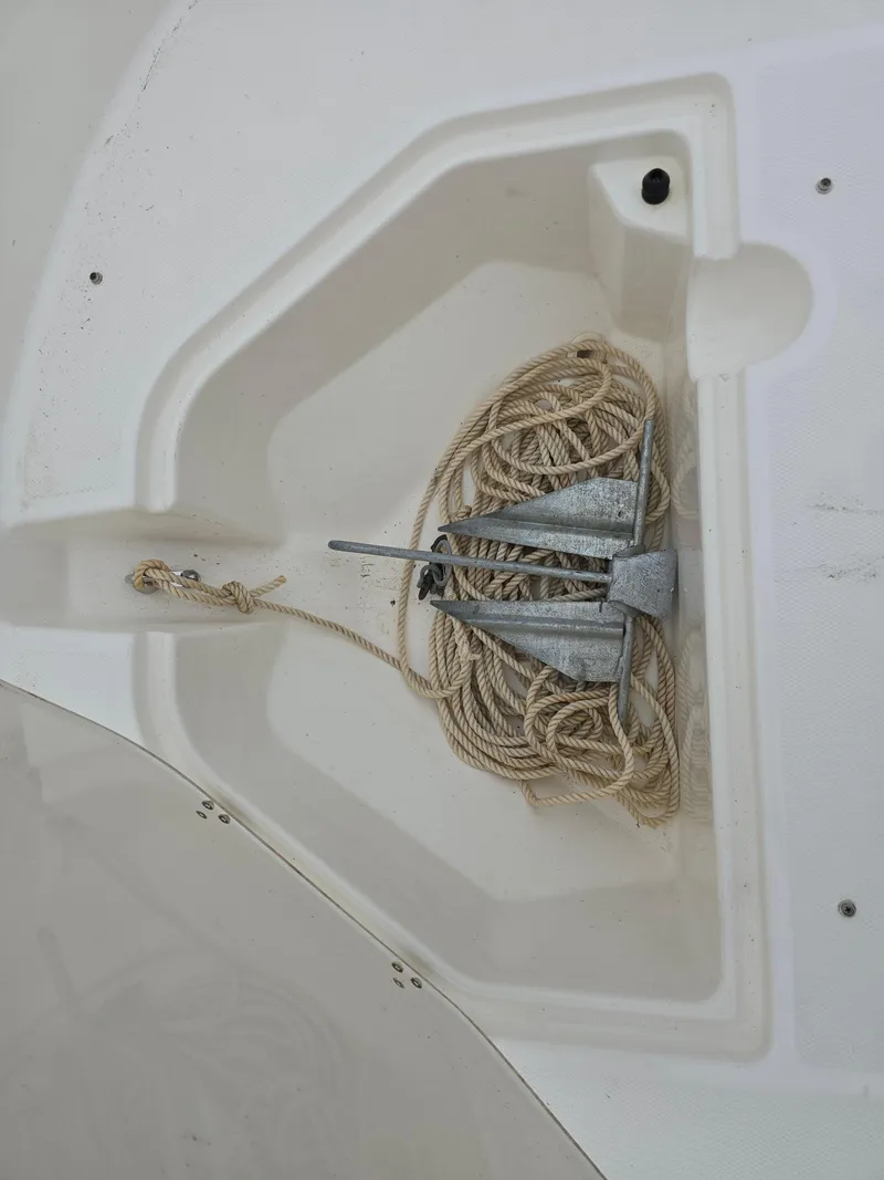 Slide: The Image of Anchor and rope storage on 2022 Boston Whaler 160 Super Sport boat. - 19