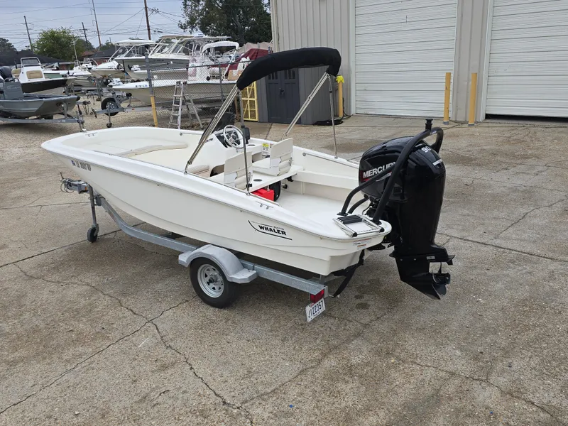 Slide: The Image of 2022 Boston Whaler 160 Super Sport boat with Mercury engine on trailer. - 7