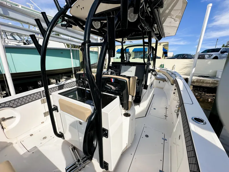 Slide: The Image of 2017 Wellcraft 302 Fisherman boat interior with modern console and seating. - 12