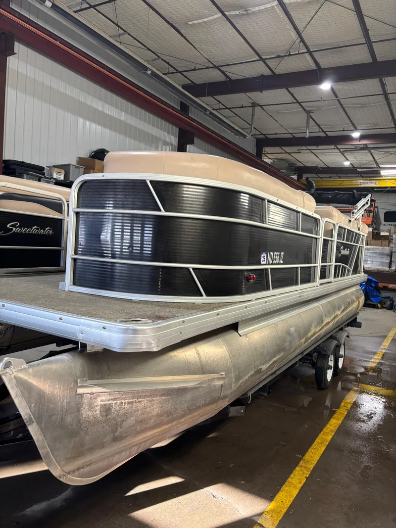 Slide: The Image of 2015 Godfrey Sweetwater 2286 pontoon boat in a storage facility. - 4