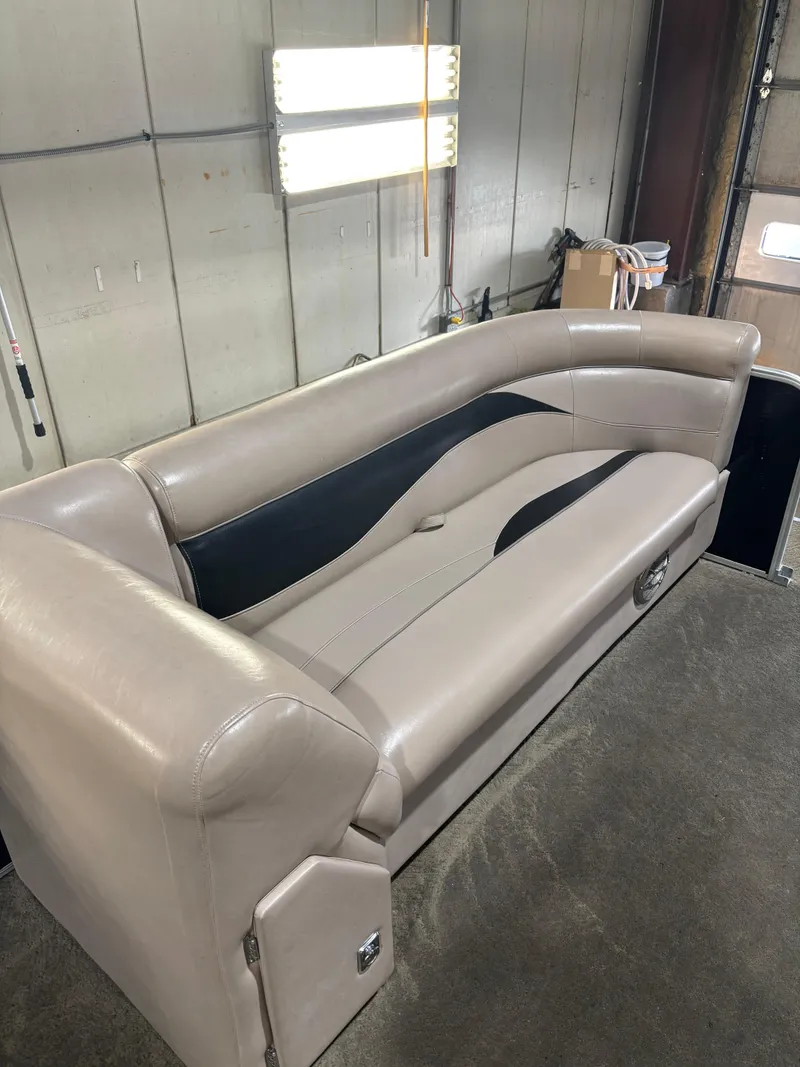 Slide: The Image of 2015 Godfrey Sweetwater 2286 boat seat in a workshop setting. - 8