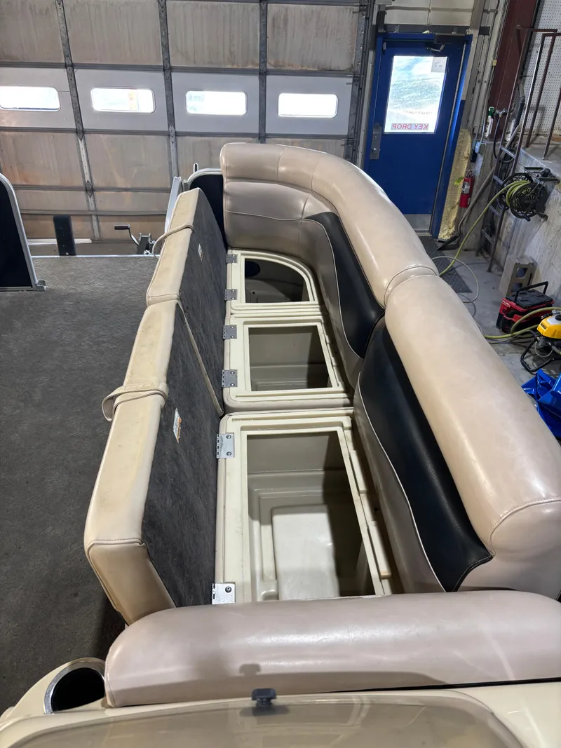 Slide: The Image of 2015 Godfrey Sweetwater 2286 boat interior with open storage compartments. - 9