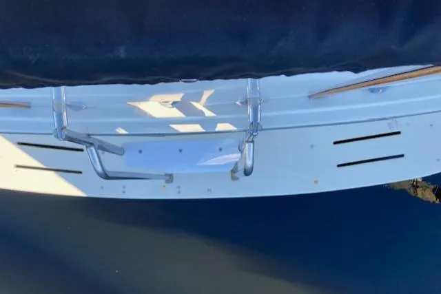 Slide: The Image of 1973 Hatteras Motor Yacht stern view with swim platform and railing. - 21