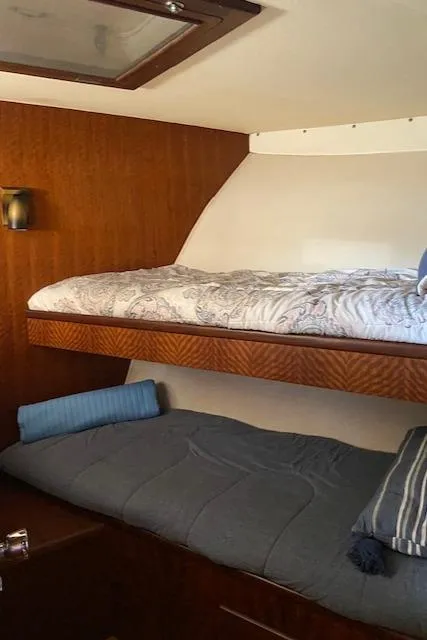 Slide: The Image of 1973 Hatteras Motor Yacht cabin with wooden interior and bunk beds. - 30