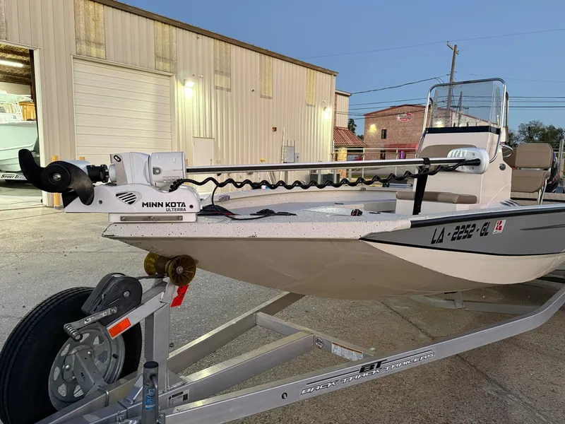 Slide: The Image of 2020 Xpress H20B boat on trailer with Minn Kota trolling motor. - 18