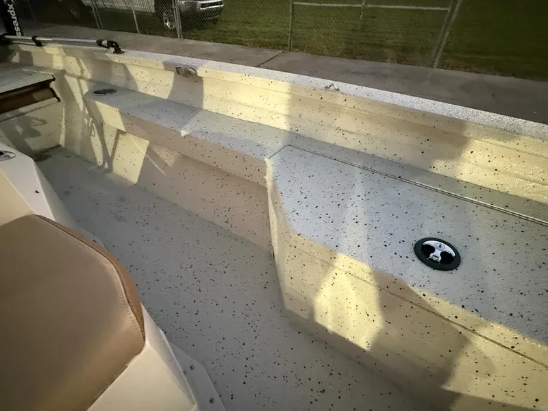 Slide: The Image of 2020 Xpress H20B boat interior with speckled flooring and seating. - 5