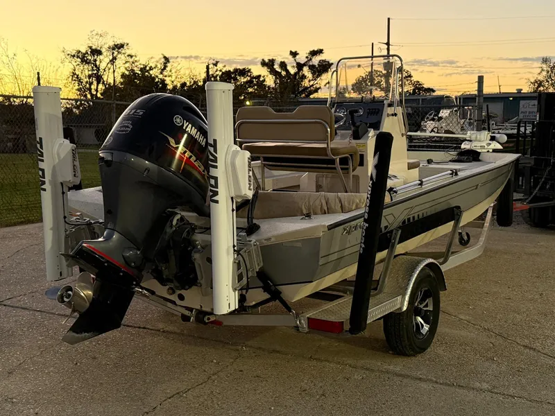 Slide: The Image of 2020 Xpress H20B boat with Yamaha motor at sunset. - 8