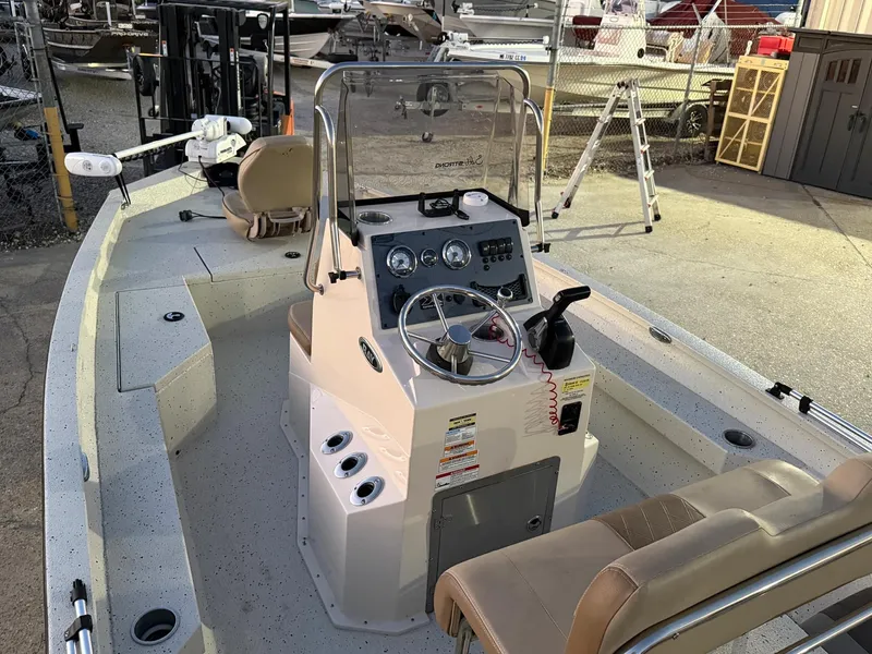 Slide: The Image of 2020 Xpress H20B boat interior with steering console and seating. - 9