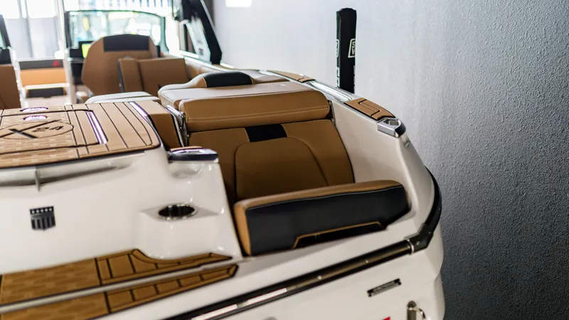 Slide: The Image of 2025 MasterCraft X24 boat interior with luxurious seating and sleek design. - 10