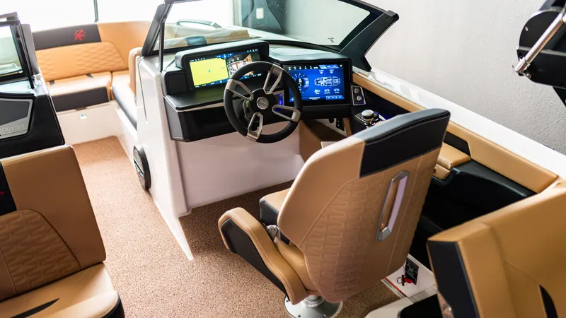 Slide: The Image of Luxurious 2025 MasterCraft X24 boat interior with advanced dashboard and leather seating. - 4