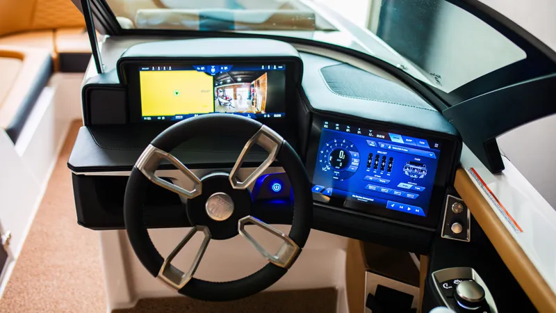 Slide: The Image of 2025 MasterCraft X24 dashboard with modern touchscreen controls and steering wheel. - 5