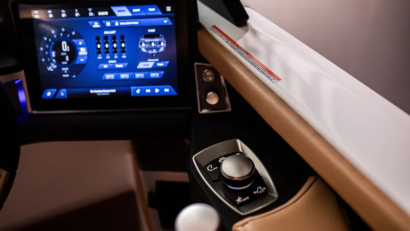 Slide: The Image of 2025 MasterCraft X24 dashboard with advanced touchscreen controls and sleek design. - 6
