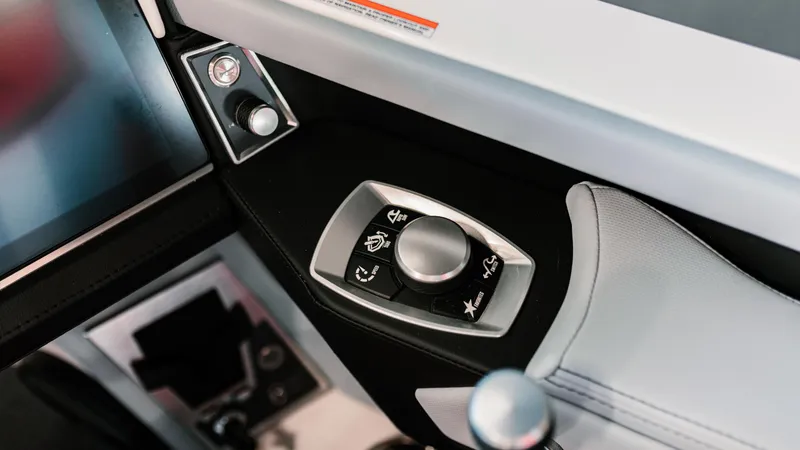 Slide: The Image of 2025 MasterCraft XT22 boat control panel with sleek design and modern features. - 4