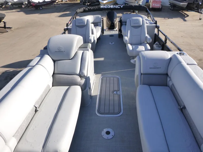 Slide: The Image of 2025 Regency 230 LE3 pontoon boat with luxurious seating and spacious deck. - 12