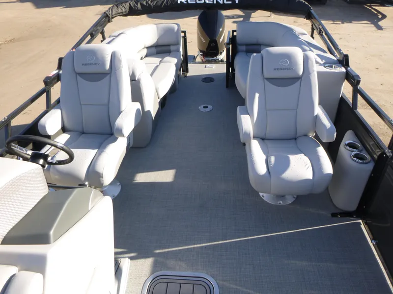 Slide: The Image of 2025 Regency 230 LE3 pontoon boat interior with plush seating and modern design. - 13