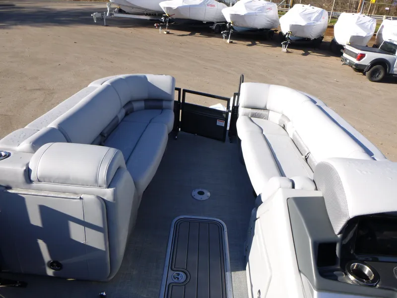 Slide: The Image of 2025 Regency 230 LE3 pontoon boat interior with gray seating and deck. - 16