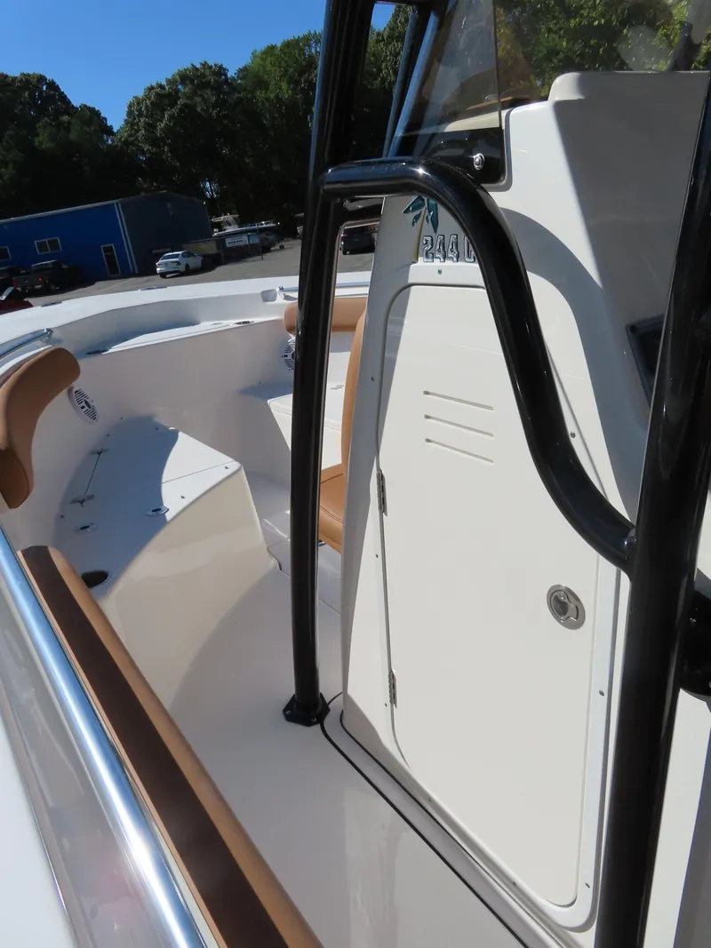 Slide: The Image of 2025 Key West 244 Center Console boat interior with seating and console view. - 16