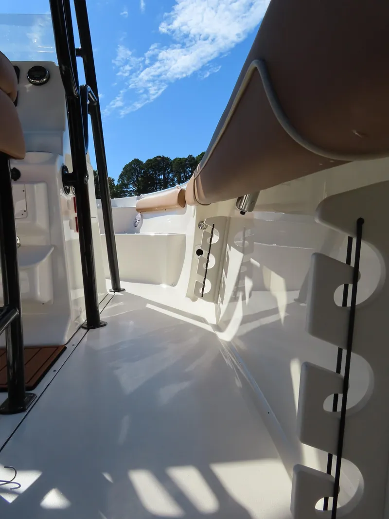 Slide: The Image of 2025 Key West 244 Center Console boat interior with rod holders and seating. - 19