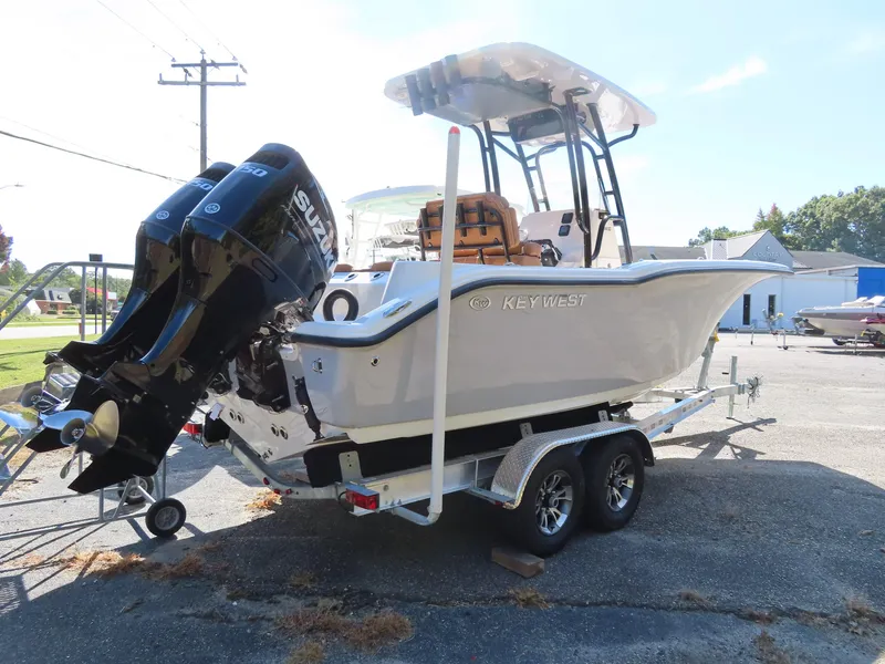 Slide: The Image of 2025 Key West 244 Center Console boat on trailer with dual outboard motors. - 3