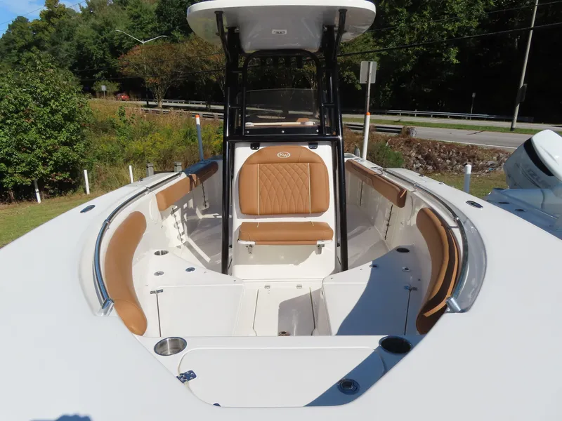 Slide: The Image of 2025 Key West 244 Center Console boat with tan seating and spacious deck. - 5