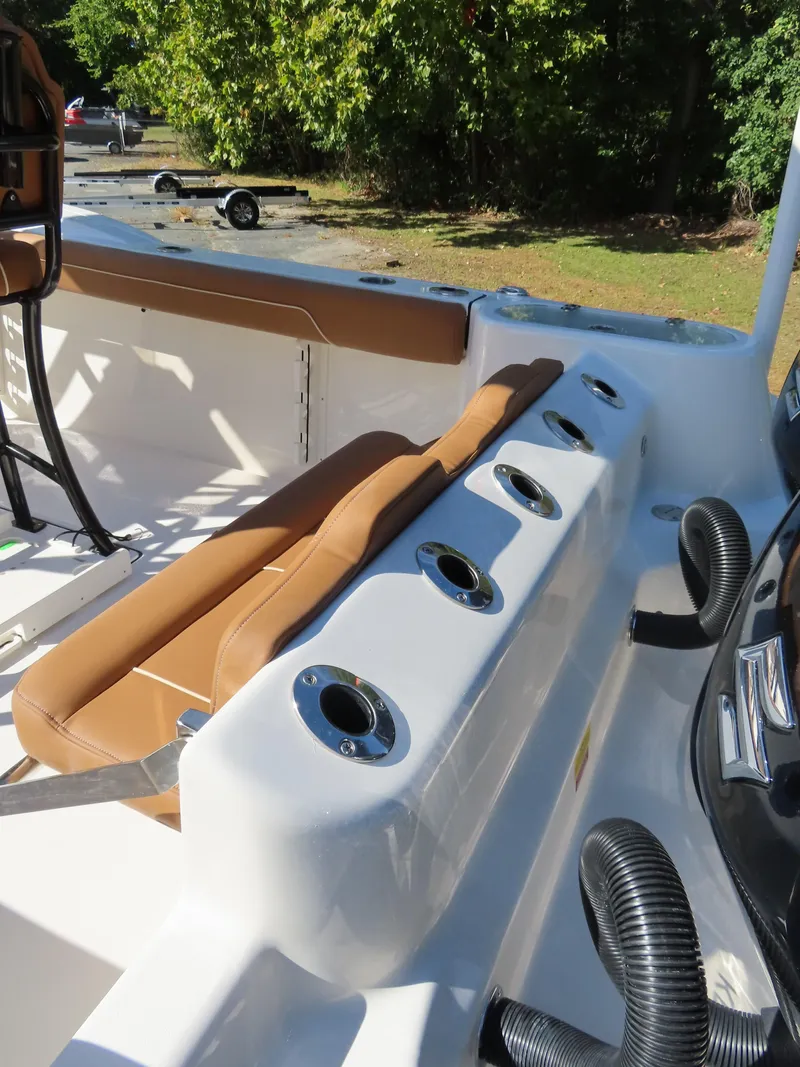 Slide: The Image of 2025 Key West 244 Center Console boat interior with rod holders and seating. - 8
