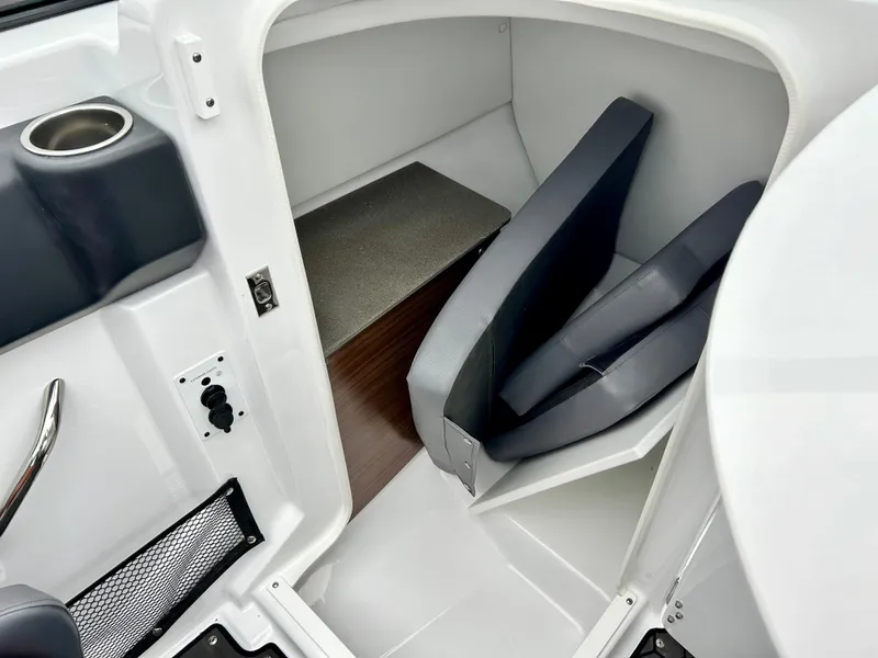 Slide: The Image of Interior cabin of 2025 Scarab 255LX boat with seating and storage. - 14