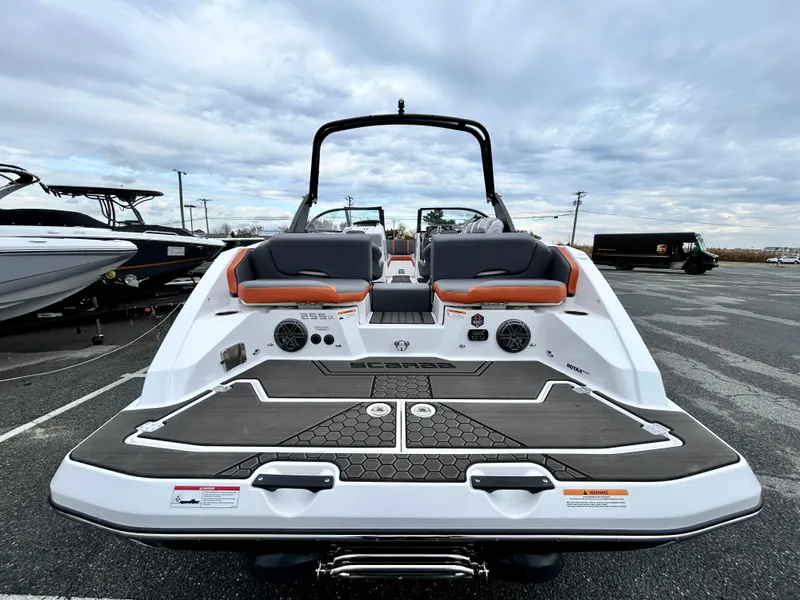 Slide: The Image of 2025 Scarab 255LX boat with sleek design and spacious seating. - 6