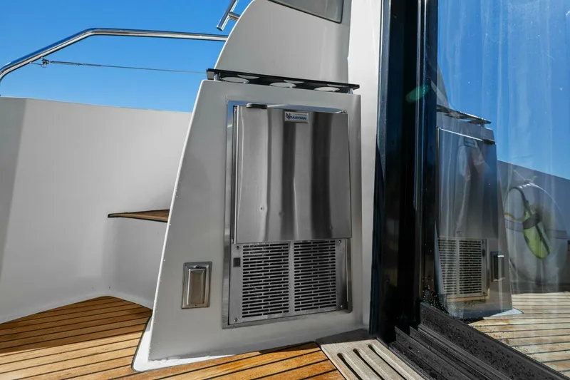 Slide: The Image of Prestige 450 S 2014 yacht deck with stainless steel appliance and wooden flooring. - 11