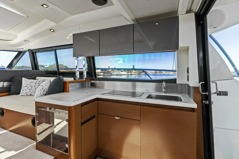 Slide: The Image of Luxurious 2014 Prestige 450 S yacht interior with modern kitchen and scenic views. - 13