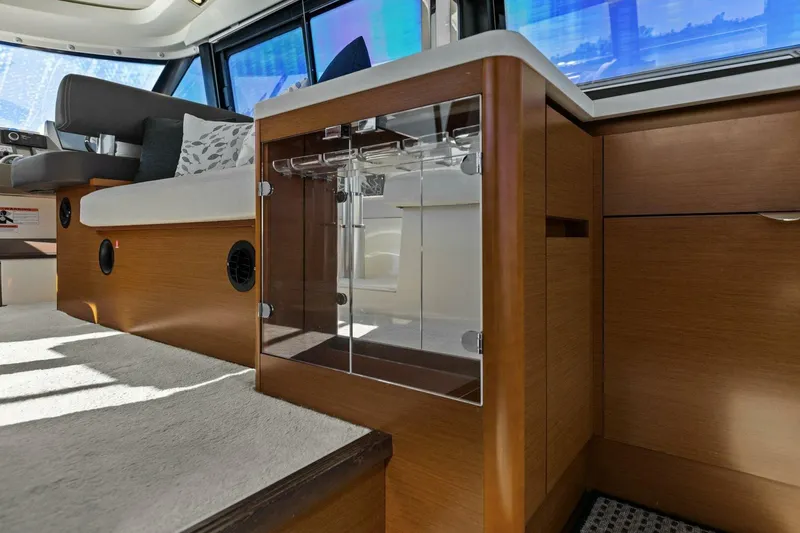 Slide: The Image of Interior of 2014 Prestige 450 S yacht with modern wood cabinetry and seating. - 14