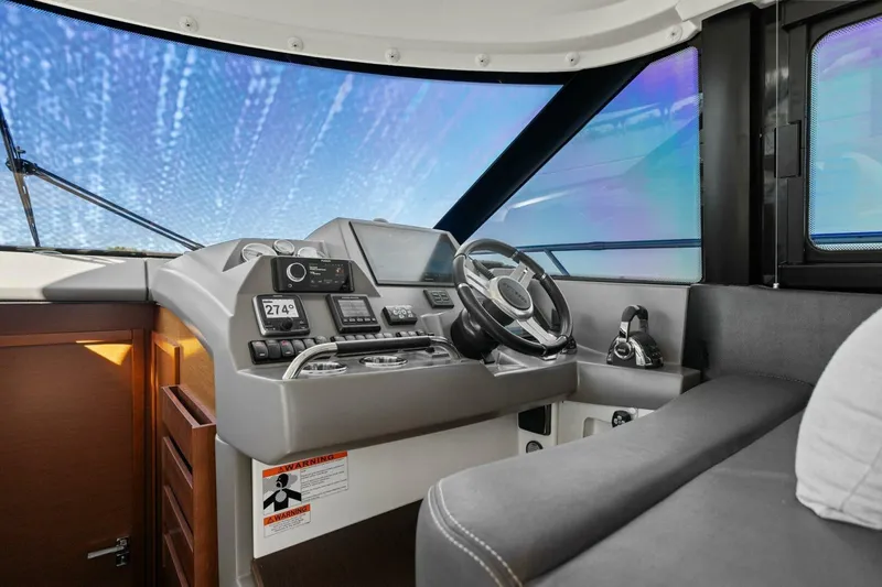 Slide: The Image of Interior cockpit of 2014 Prestige 450 S yacht with modern navigation equipment. - 19