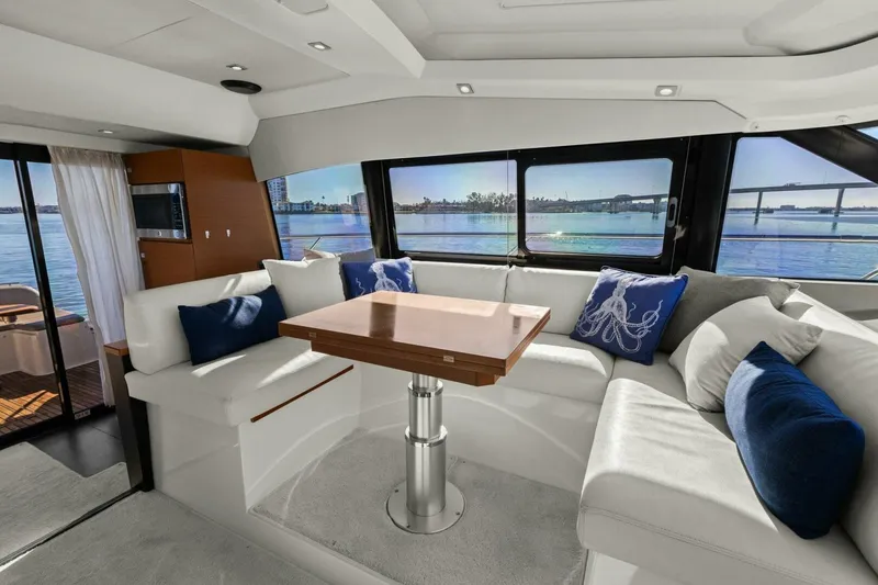 Slide: The Image of Luxurious interior of 2014 Prestige 450 S yacht with elegant seating and scenic views. - 22
