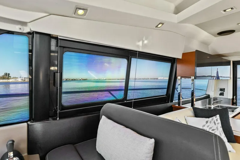 Slide: The Image of Interior of 2014 Prestige 450 S yacht with scenic ocean view through windows. - 28