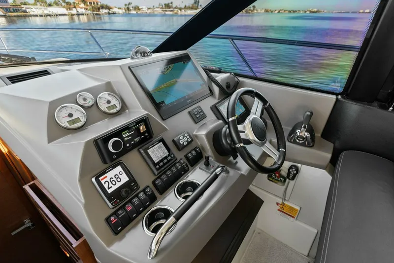 Slide: The Image of Control panel of a 2014 Prestige 450 S yacht with scenic water view. - 3