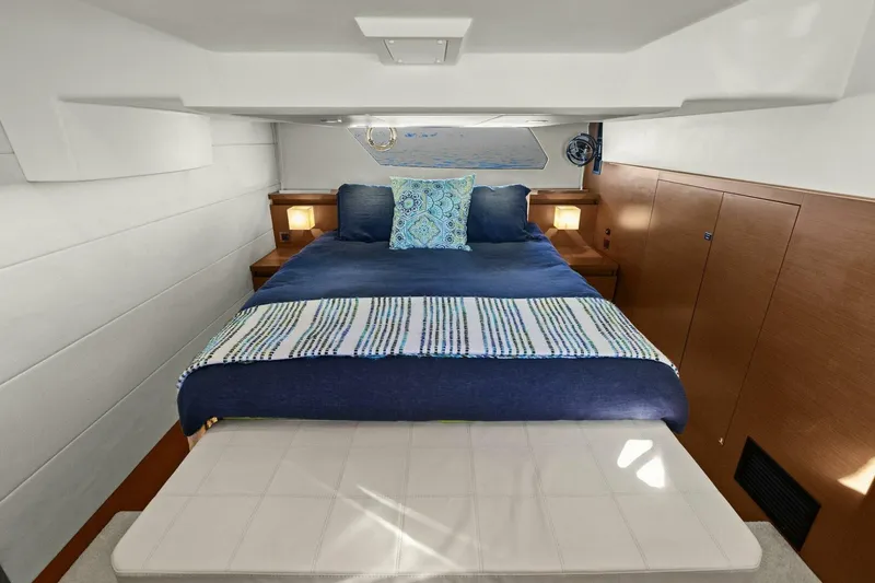 Slide: The Image of Luxurious cabin interior of 2014 Prestige 450 S yacht with cozy bedding. - 31
