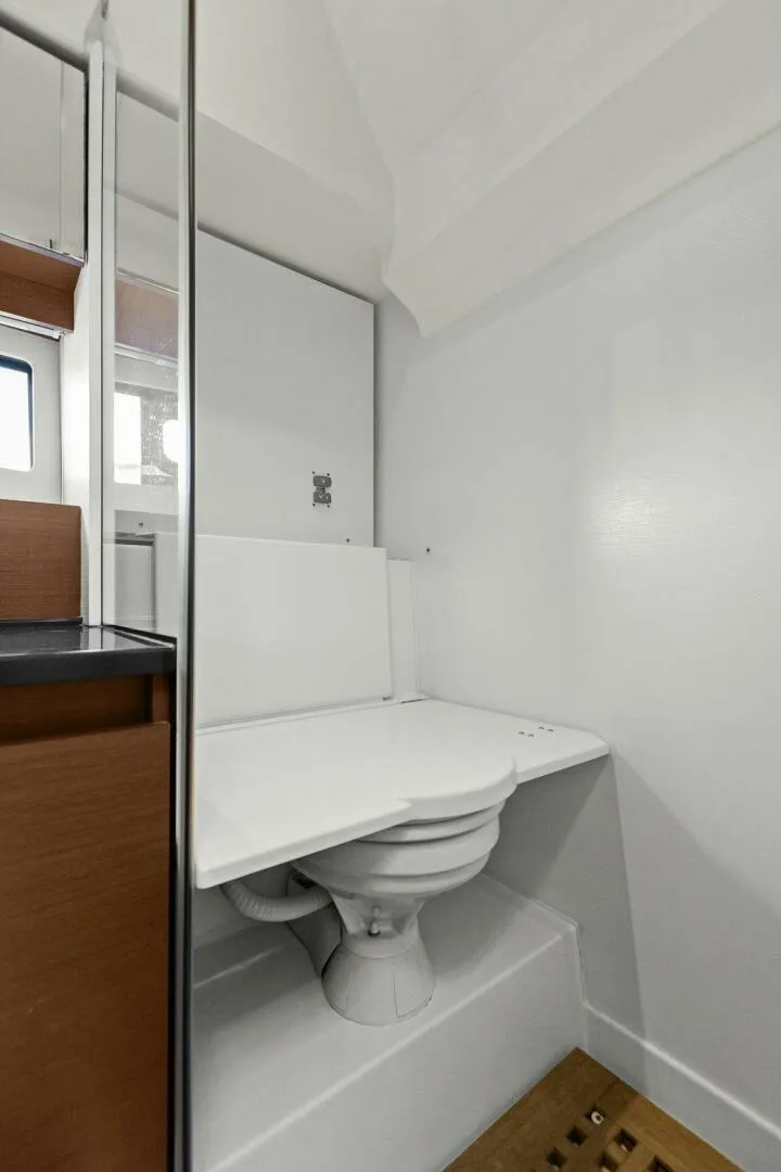 Slide: The Image of Compact bathroom in 2014 Prestige 450 S yacht with modern white fixtures. - 35