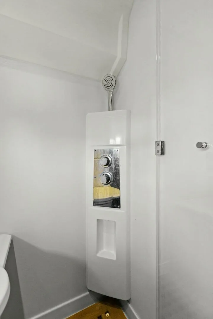Slide: The Image of Shower unit in 2014 Prestige 450 S yacht bathroom, featuring modern controls and sleek design. - 36